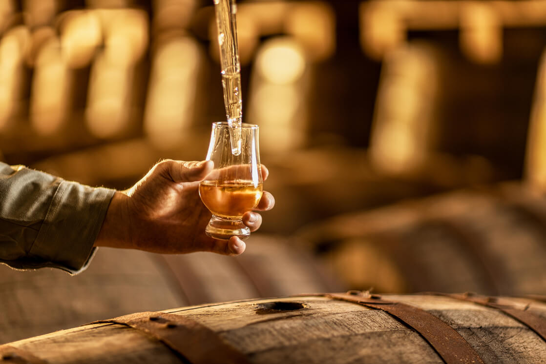 Cask-strength whisky being poured into a tasting glass